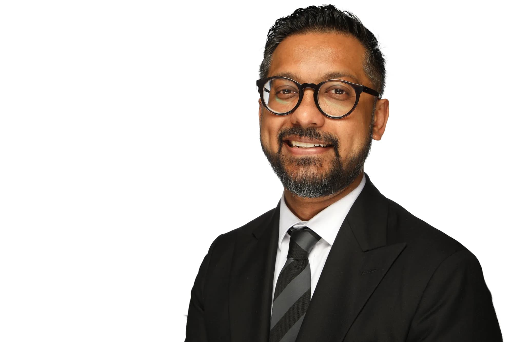 Corporate headshot of a man wearing glasses on a white background
