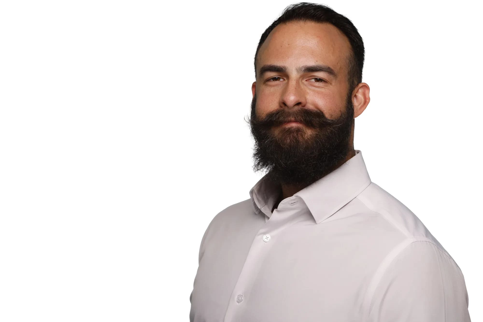 Corporate headshot of a bearded man in a light shirt, white background