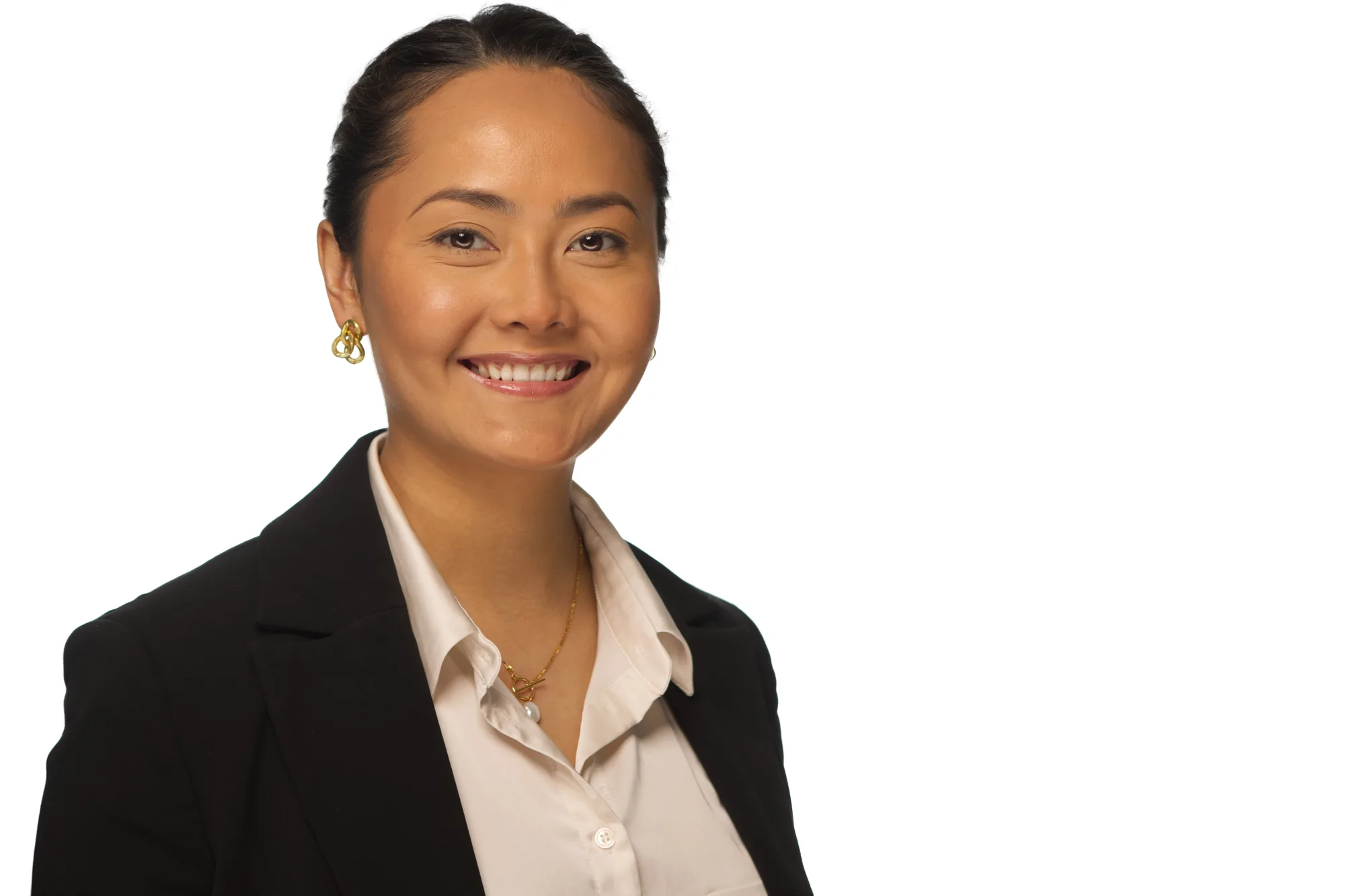 Corporate headshot of a woman in a black blazer on a white background, Sydney