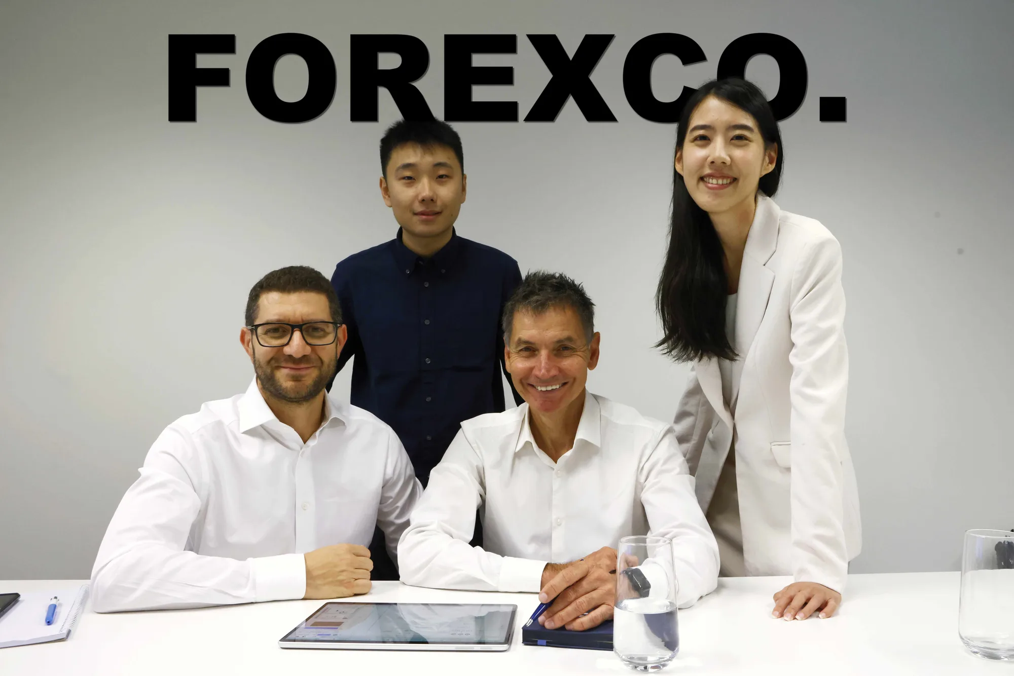 Team photographed around a table in a Sydney office