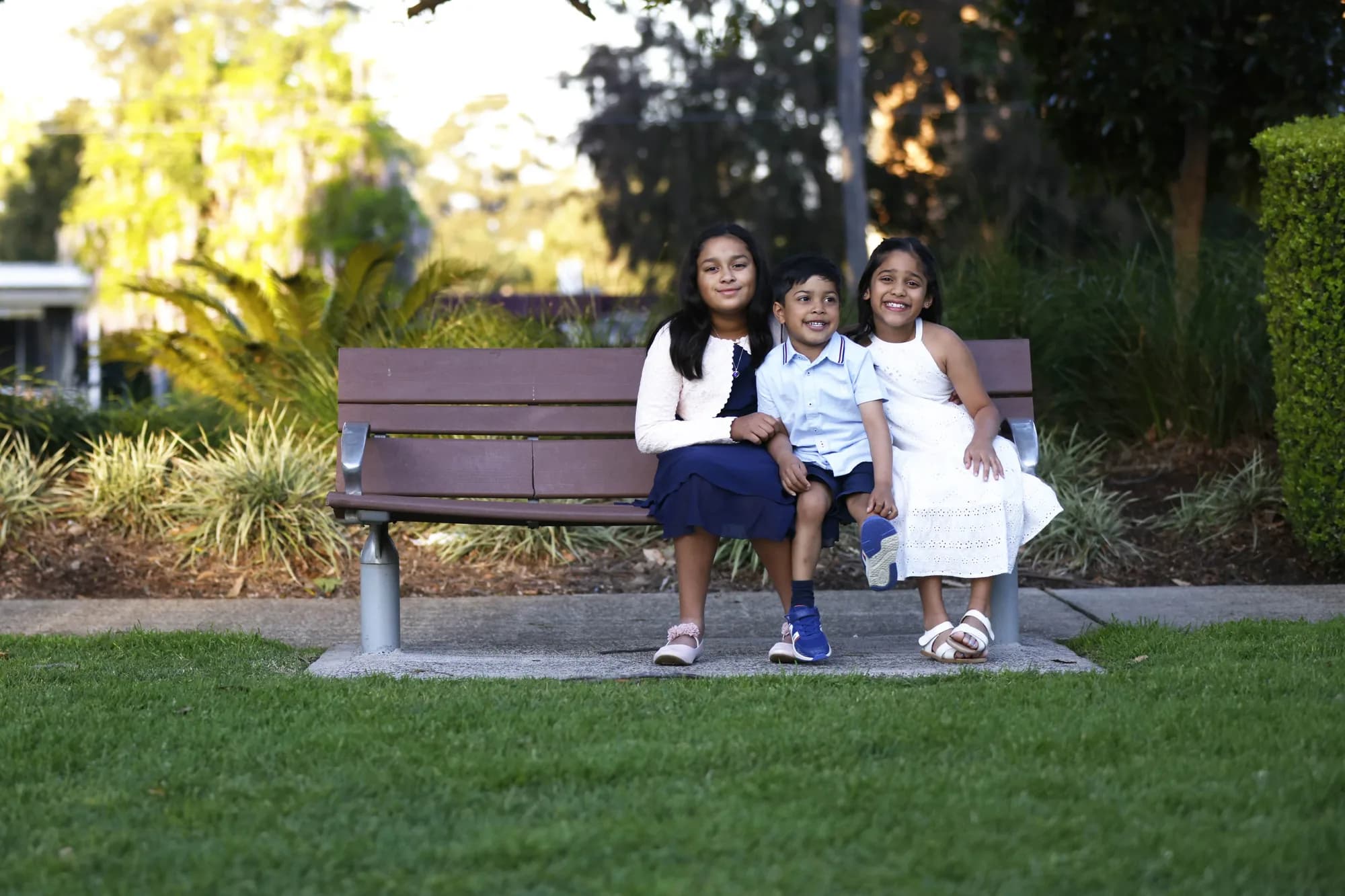 Family on a park bench during an outdoor session, Sydney