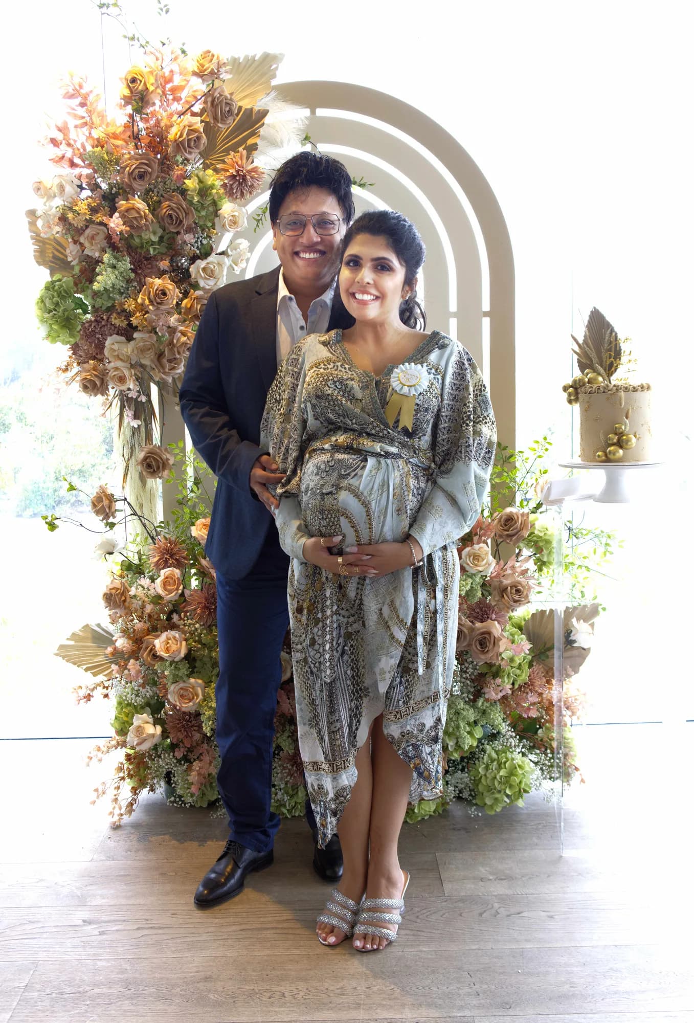 Family portrait beneath a floral arch, Sydney