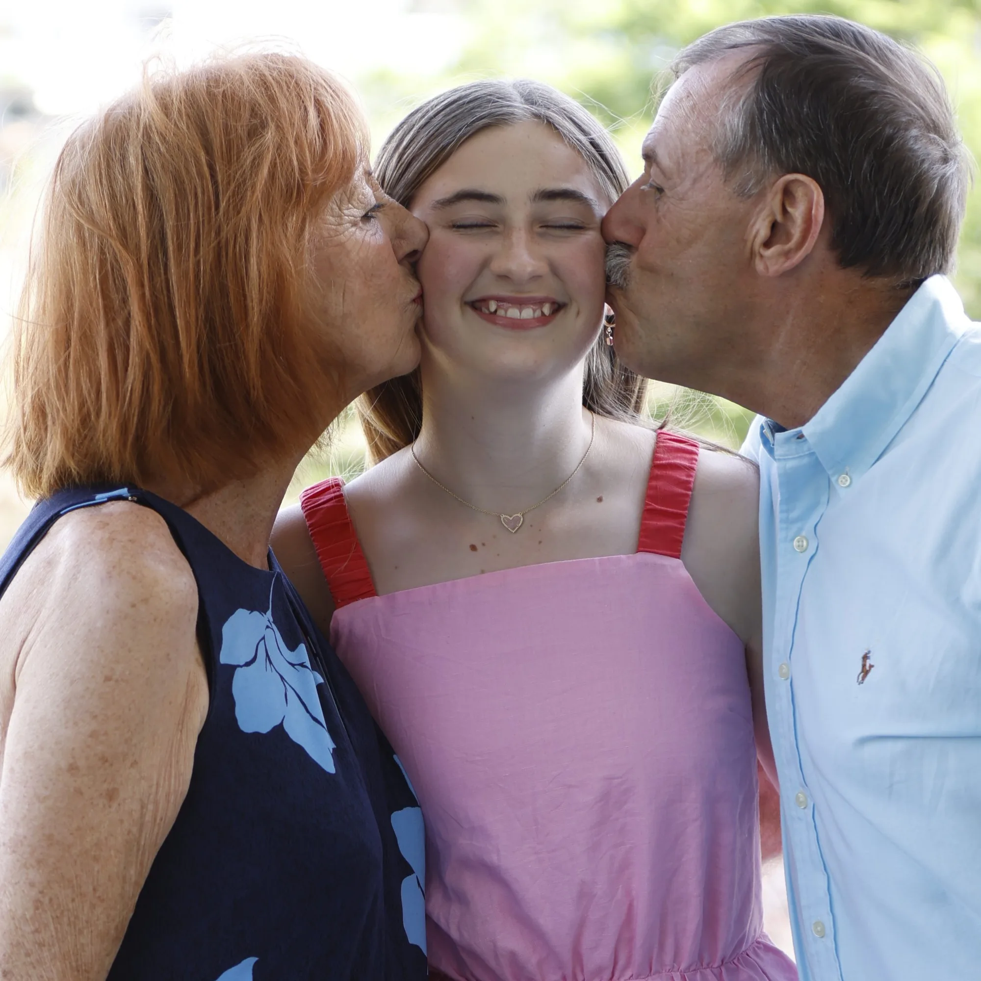 Parents and child in a candid outdoor family session, Sydney