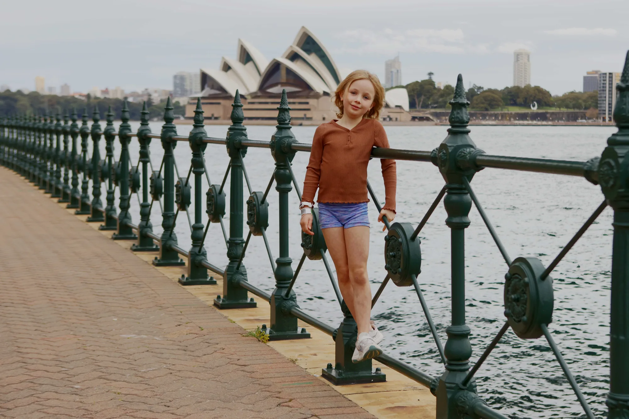 Family portrait by Sydney Harbour with the Opera House behind