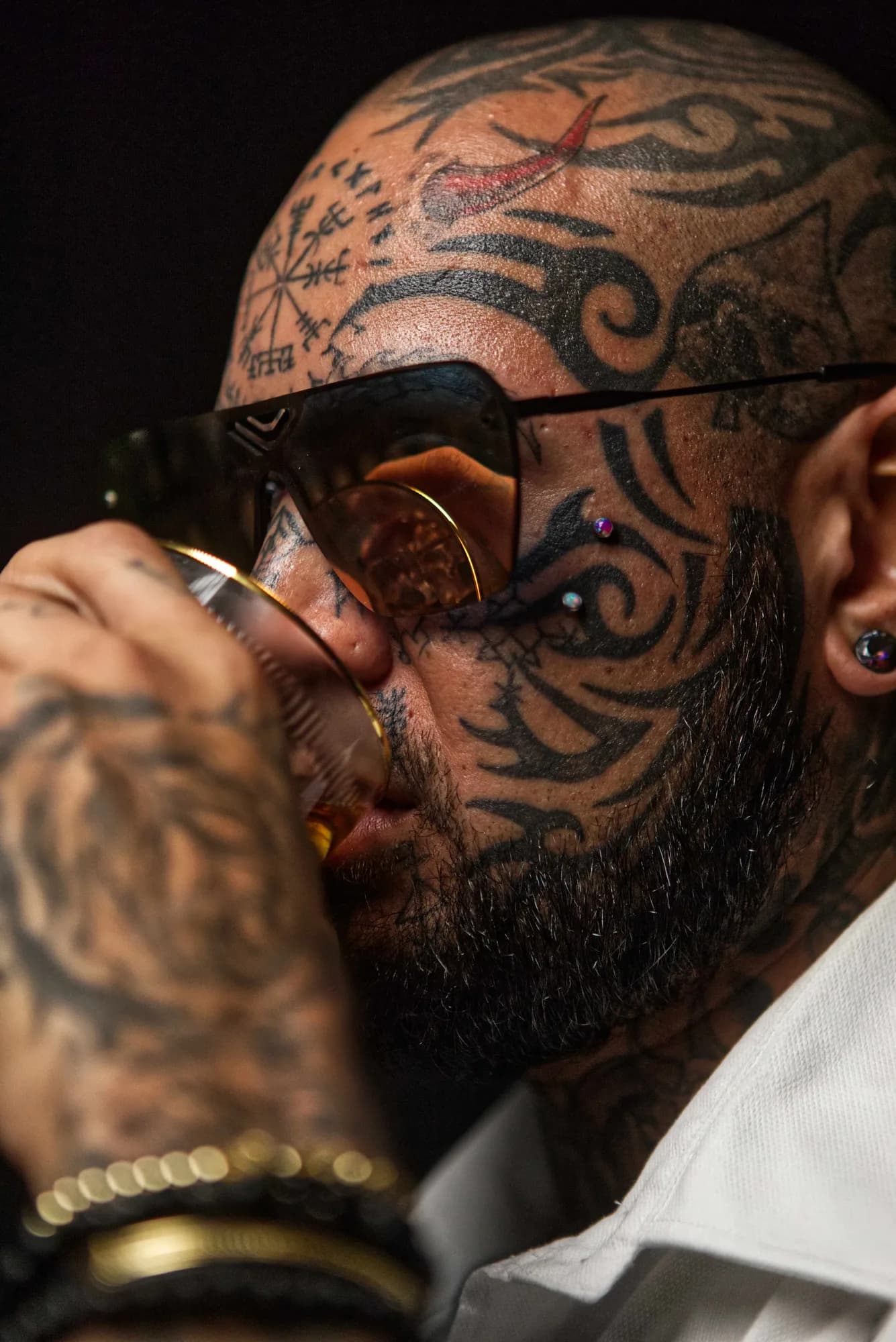 Character model portrait of a tattooed man in dramatic studio light, Sydney